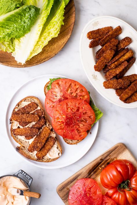 This vegan BLT with tempeh 'bacon' and spicy mayo is a hearty and simple-to-make sandwich. Perfect for picnics and work-from-home lunches. thenewbaguette.com Vegan Blt, Vegan Blt Sandwich, Toasted Crostini, Vegan Protein Sources, Tempeh Bacon, Healthy Lunches For Work, Blt Sandwich, Vegan Bacon, Spicy Mayo