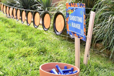 Paper plate "shooting range" on stakes in the ground; party shirts Hunting Theme Party Games, Police Themed Birthday Party Kids Games, Bow And Arrow Birthday Party, Silly String Games, Boy 11th Birthday Party Ideas, Nerf Themed Birthday Party, 8th Birthday Boy, 6th Birthday Boy, Camping Party Games