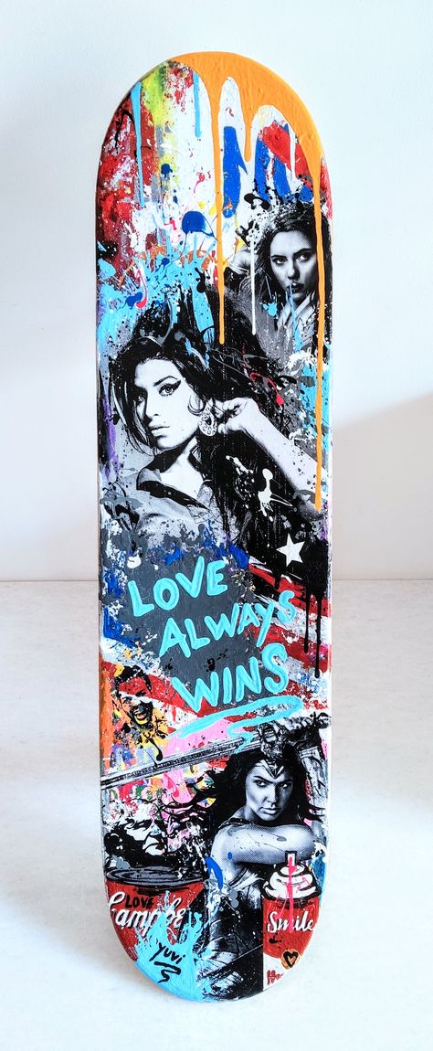 This is an original Skateboard Pop Art Wall Sculpture by Israeli pop artist Yuvi. It is painted in a pop street art style with graffiti and many recognizable pop culture figures such as Amy Winehouse, Gal Gadot and more. The artwork is signed by Yuvi on the other side of the Skateboard. Original Skateboards, Pop Art Sculpture, Painted Skateboard, Street Art Style, Pop Art Wall, Love Always Wins, Art Love, Amy Winehouse, Love Always