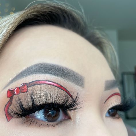 Simple red ribbon graphic eyeliner makeup look inspired by @paytons.makeup and @greta.mikki on IG Ribbon Eyeliner, Graphic Eyeliner, No Eyeliner Makeup, Red Ribbon, Halloween Makeup, Eyeliner, Ribbon, Makeup Looks, Makeup