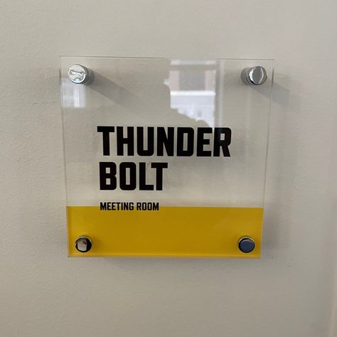 We made these custom acrylic identification signs to mark meeting rooms at Chemistry, a creative advertising agency. They honored past partner Geoff Tolley by naming the main agency conference room after him, and also showed their love for a certain local amusement park’s most famous rides – the Jack Rabbit and Thunderbolt.

#spark #signs #signage #signdesign #signagedesign #interiorsigns #acrylicsigns Creative Agency Office, Meeting Room Sign, Meeting Room Signage, Identification Signage, Meeting Room Names, Space Branding, Room Signage, Agency Office, Office Signage