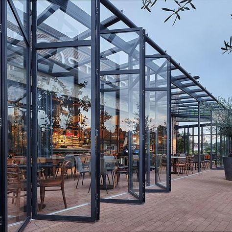 Image 1 of 29 from gallery of Bi-Folding Doors - Highline | Solarlux. French Doors Modern, Industrial Coffee Shop, Exterior French Doors, Awning Roof, Outdoor Restaurant Design, Folding Glass Doors, French Doors Exterior, Doors Modern, Sliding Door Design