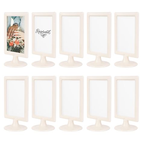 PRICES MAY VARY. Stylish & Versatile Decor - These double sided picture frames 4x6 are perfect for events & home décor. Showcase a variety of 4x6 photos in these standing frames. Ideal as table number frames for special occasions, the double sided frame allows you to easily swap images to match any theme. Transform any space with these elegant 2 sided frames, adding a touch of class and adaptability to suit any situation. Great for Business Establishments - These tabletop pedestal frames will el Standing Picture Frames, Tabletop Picture Frames, Grad Party Decorations, 4x6 Picture Frames, Side Stand, 10 Count, White Picture Frames, Frame Stand, Graduation Party Decor