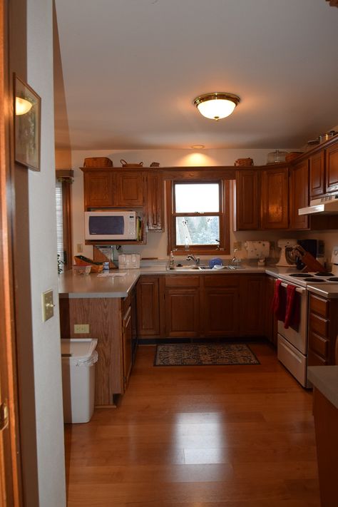 1990's Kitchen Remodel - Edge Construction Company 90s Style Kitchen, 1990 Kitchen, Older Kitchen, 1990s Kitchen, Gold Lighting, Gold Light Fixture, Two Tone Cabinets, Oak Cabinets, Old Kitchen