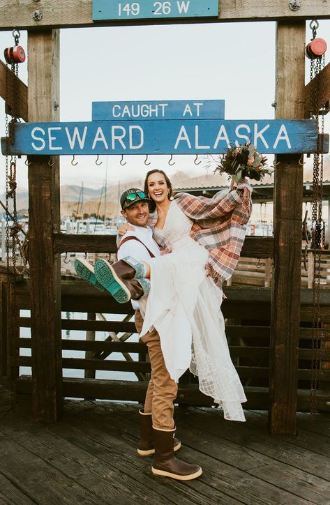 Gorgeous couple who just eloped in Seward, Alaska in front of the "Caught at Seward, Alaska" sign at the fishing harbor. #elopement Alaska Wedding Photos, Alaska Beach Wedding, Alaska Elopement Ideas, Alaska Wedding Dress, Alaska Wedding Ideas, Cruise Elopement, Alaskan Elopement, Alaska Honeymoon, Travel To Alaska