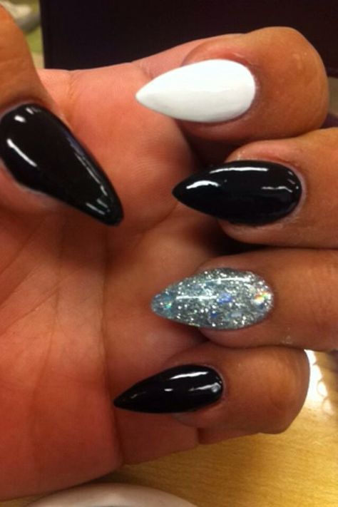 Stiletto nails, black and white nails, accent nail, glitter acrylic,glitter polish Black White And Silver Nails, Nails Accent Nail, Black And White Nails, Black Stiletto Nails, Glitter Accent Nails, White And Silver Nails, Accent Nail, Homecoming Nails Acrylic, White Acrylic Nails