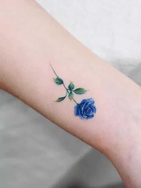 Blue Rose Tattoos: Meanings, Tattoo Designs & Placement Blue Rose Tattoo Meaning, Rose Tattoo On Ankle, Rose Tattoo With Name, Purple Rose Tattoos, Rose Tattoo Stencil, Rose Shoulder Tattoo, Rose Tattoos For Men, Blue Rose Tattoos, Romantic Questions