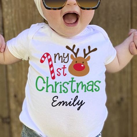 My 1st Christmas Personalized Kid Baby T-Shirt Christmas t shirt #christmastshirt T shirt #tshirt t-shirt #t_shirt t shirts #tshirts t-shirts #t_shirts T shirt design #tshirtdesign T-shirt designs #t_shirtdesign T shirts designs #tshirtsdesigns 4.38 Cricut Kids Christmas Shirts, Baby Christmas Shirt, Tshirt Prints, My 1st Christmas, Baby's 1st Christmas, Baby Reindeer, Christmas Shirts For Kids, Christmas T Shirt Design, Top Baby Products