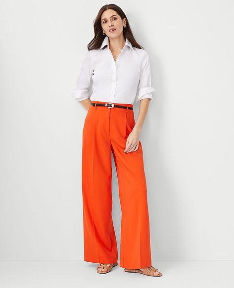 Our wide leg pant is a modern must-have with a perfect drape and high waist that endlessly flatters. Belt loops. Front zip with double hook-and-bar closure. Front pleats. Front off-seam pockets. Back besom pockets.,Leg Shape:Leg Shape: Wide Leg � a modern must-have with a statement leg and Flattering high waist,Rise:High rise: sits 1/2" to 1" below natural waist,Imported:Imported,Fit:Fit: Relaxed & easy,Length:Full length: 31" inseam with 26 1/2" leg opening,Fabrication:73% Polyester, 20% Rayon, 7% Spandex,Garment Care:Machine Washable The Single Pleated Wide Leg Pant by Ann Taylor Size regular - 12 Flame Azalea Women's Regular, Wide, Leg, Pants, 73%, Polyester, 20%, Rayon, 7%, Spandex, Machine, Washable Flame Azalea, Orange Pants Outfit, Petite Fashion Outfits, Clothes Capsule Wardrobe, Dressy Jeans, Executive Woman, Ruched Pants, Orange Pants, Suit Jackets For Women