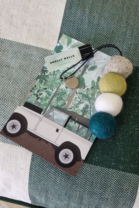 A set of 3 green wooden balls on a string on a postcard of a jeep in the rain forest with a bottle of fragrance. Caravan Bathroom, Felt Car, Car Smell, Asian Fusion, Smell Amazing, Great Gifts For Men, Car Air Freshener, Affordable Gifts, Smells Amazing