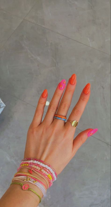 Oval Nails Designs Pink And Orange, One Nail Different Color Ring Finger, Fushia And Orange Nails, Cute Orange And Pink Nails, Pink And Orange Spring Nails, Bright Orange Nails With Design Summer, Nails To Match Orange Dress, Summer Pink And Orange Nails, Red Pink Orange Nails