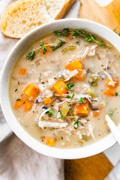 This slow cooker chicken wild rice soup is creamy and comforting, but still nourishing with lots of veggies, shredded chicken and wild rice. Added bonus: it's so easy to whip up! #wildrice #chickensoup #chickenandricesoup Chicken And Wild Rice Soup, Chicken Wild Rice, Eating Bird Food, Chicken Wild Rice Soup, Broiled Chicken, Cheesy Chicken Broccoli, Chicken And Wild Rice, Wild Rice Soup, Delicious Soup Recipes