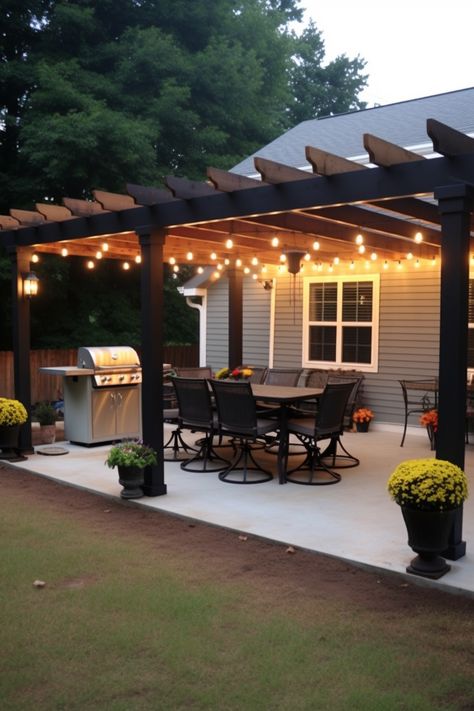 Transform your patio into an inviting outdoor dining space with a stylish pergola. Embrace high contrast lighting and a dark gray and black color scheme for a touch of industrial, cabincore charm. Enjoy meals in the serene ambiance of the southern countryside. Backyard Patio Designs Covered, Diy Covered Patio, Diy Patio Cover, High Contrast Lighting, Yard Oasis, Outdoor Patio Ideas Backyards, Bloxburg Building, Pathway Landscaping, Pergola Lighting