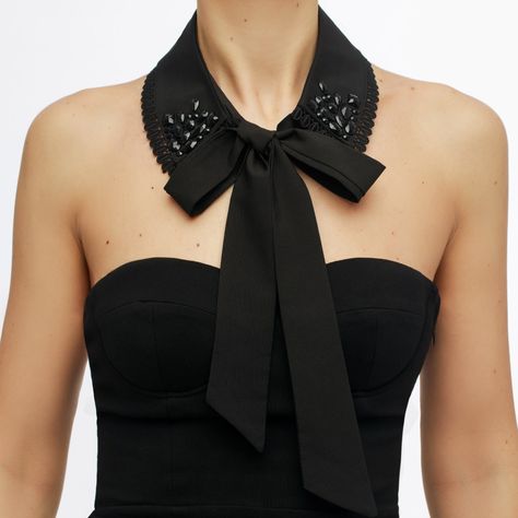 An all-black Alaia collar has been crafted using crêpe de Chine and features black rhinestone embellishments on the sides. Tie it as a bow or let it flow freely - the choice is yours. A collar will brilliantly complement strapless dresses or can be added as an extension of a black blazer. Material content:   Black cotton fabric Black decorative rhinestones   Caring instructions Not washable. Spot clean with a damp cloth Embellished Collar Dress, Detachable Collar Outfit, Detached Collar, The Wizard Of Oz Costumes, Stylish Business Outfits, Blazer Details, Blouse Collar, Collars Diy, Black Cotton Fabric