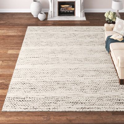 This area rug is a versatile addition to almost any room in your home. It has a medium pile height and no backing that make it flexible, a cinch to clean, and easy to slip under any door. Plus, it features a two-tone black and cream design that blends in with any colour palette and gives it a striped look. We recommend spot cleaning this rug, and shaking it out when it needs a clean. Hand-curated by Kelly Clarkson. | Kelly Clarkson Home Sylvie Chevron Handmade Flatweave Wool Cream/Black Area Rug Rugs For Dining Room Table, Bedroom Rugs Under Bed, Beige Couch, Coastal Dining, Kelly Clarkson Home, Neutral Area Rugs, Cream Design, Flatweave Area Rug, Black Chair