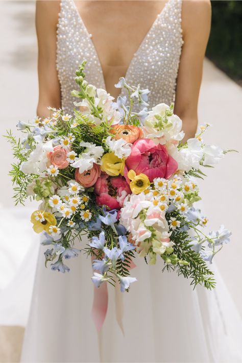 Romee Willow Florals created this colorful bridal bouquet for Alex & Aeryn's spring wedding at Greenhouse Loft. The bride wanted her bouquet to look colorful, loose, natural and whimsical, like a bouquet of wildflowers. They gathered inspiration from one of their favorite Wes Anderson movies, Moonrise Kingdom. Learn more details and see photos from their spring wedding on the blog. Wedding planner: Naturally Yours Events Photography: Ed and Aileen Photography Colourful Flower Bouquet Wedding, Wedding Flowers Multicolor, Whimsical Garden Wedding Bouquet, April Bridal Bouquet, Colourful Wedding Bouquets Brides, Bride Bouquets Spring, Bridesmaid Wildflower Bouquet, Summer Wedding Wildflowers, Whimsical Flowers Wedding