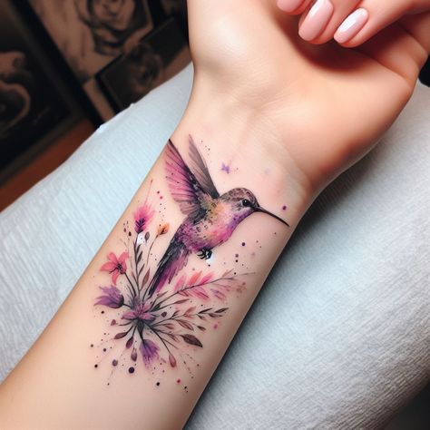 Discover 29+ Stunning Hummingbird Tattoo Ideas That Will Leave You Speechless! 🌺🕊️ Small Elegant Tattoos For Women Unique, Hummingbird Tattoo Wrist, Water Colour Tattoo Designs, Tattoo For Artist, Hummingbird Wrist Tattoo, Watercolor Art Tattoo, Flower Tattoos Simple, Grandkids Tattoo Ideas, Tattoo For Brother