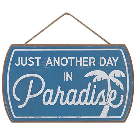 PRICES MAY VARY. Open Road Brands official product: Paradise is wherever your people are! Use this lovely blue sign to add a nautical touch to your home. Fun Vintage Sign: With a sweet palm tree illustration and stylish typography, this wall art is a must-have addition to your other beach-themed decor. Material: This must-have wall decor is made of MDF wood with a string for quick and easy display. Made in the USA. Places to Use: This simple but commanding sign will make a statement in your beac Beachy Living Room, Beach Signs Wooden, Just Another Day In Paradise, House Lake, Plain Wall, Another Day In Paradise, Fa Fal, Beach Theme Decor, Cute Signs