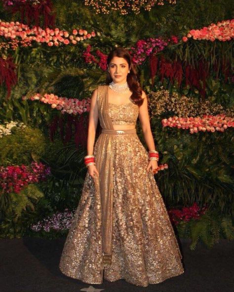 50 best pictures from Anushka Sharma and Virat Kohli’s Mumbai reception Golden Lehenga Brides, Golden Bridal Lehenga, भारतीय दुल्हन संबंधी, Golden Lehenga, Engagement Dress For Bride, डिजाइनर कपड़े, Mumbai Wedding, Reception Outfit, Sabyasachi Lehenga