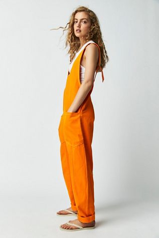 We The Free High Roller Jumpsuit | Free People Outfit Rock, Orange Jumpsuit, Jumpsuit With Pockets, Stylish Jumpsuit, High Roller, Loose Jumpsuit, Suspender Pants, Effortlessly Chic Outfits, Peacock Green