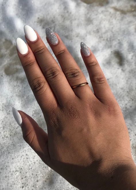 Almond white nails with silver glitter accent #sns #nails #glitternails #whitenails Almond Nails With Glitter, Almond White Nails, Clear Glitter Nails, Acrylic Nails Almond Shape, Nails With Glitter, Glitter Accent Nails, White And Silver Nails, Pink Ombre Nails, White Glitter Nails