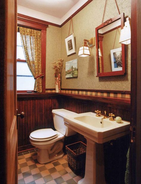 This Chicago bath has a historical feel done up in a dark wood wainscot and checkerboard floor. Art and mirror hang from a picture molding, a nice detail. Greene Craftsman Style Bathroom, Arts And Crafts Bathroom, Bungalow Bathroom, Faux Wainscoting, Wood Wainscoting, Beadboard Wainscoting, Kids Bedroom Remodel, Craftsman Bathroom, Dining Room Wainscoting