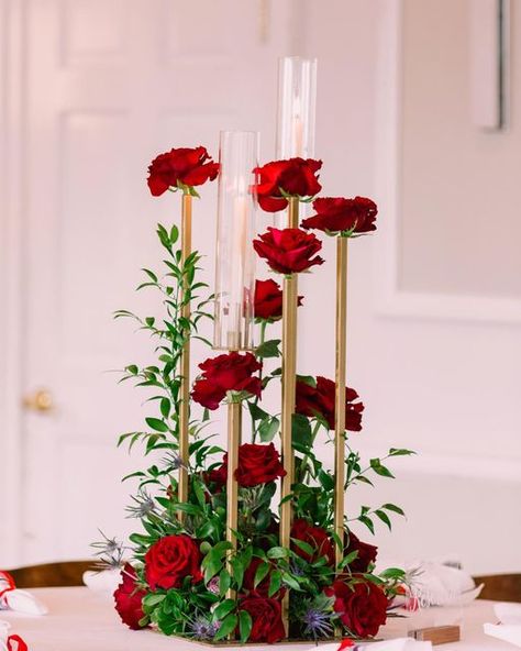 Kristi Sanders| Wedding and Event Florist + Designer Florida/GA on Instagram: "“She’s at peace and yet somehow on fire.” -Samantha King @woodlandfields thank you for always capturing the details so perfectly. . . . #tallahasseeweddings #tallahasseeweddingflorist #candlecenterpiece #romantic #wedatlast #atlastflorals #redflowers @woodlandfields @sweetteatallahassee @atlastflorals @capital_city_cc" Red Wedding Centerpieces Elegant, Red Centerpieces Wedding, Red And White Centerpieces, Tall Flower Centerpieces, Engagement Party Centerpieces, Candelabra Flowers, Samantha King, Red Centerpieces, Tulip Wedding