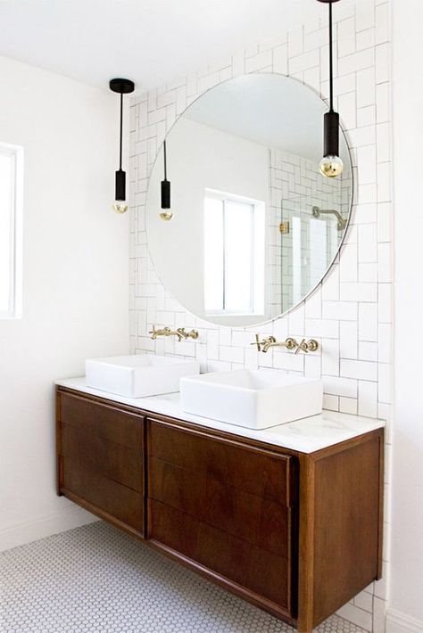 Think you’re over the subway tile trend? Think again – you haven’t seen subway tile like this before! This affordable, versatile, and classic material can be used so many different ways. Try beveled tiles, mirrored tiles, colorful tiles, unexpected placement, and more! These fun ways to mix up this tile trend will make you fall in love with subway tile all over again. Cheap Tiles, Bath Lighting, Mid Century Modern Bathroom, Lighting Bathroom, Herringbone Backsplash, Bathroom Pendant, Bad Inspiration, Decor Baie, Mirror On The Wall