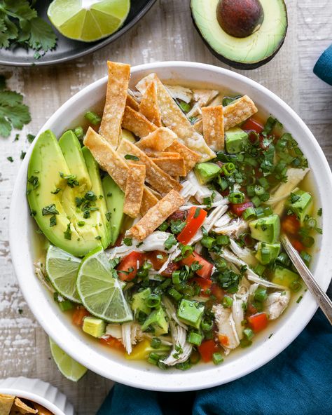 An easy crockpot soup that's full of Mexican flare! It's loaded with shredded chicken, creamy avocado, cilantro, lots of lime and best served with crispy tortilla strips on top! It's the perfect cozy weeknight meal! Chicken Lime Tortilla Soup, Chicken Cilantro Lime Soup, Chicken Avocado Tortilla Soup, Mexican Chicken Lime Soup, Cilantro Lime Soup, Chicken Avocado Lime Soup, Avocado Lime Soup, Cilantro Soup, Chicken Lime Soup