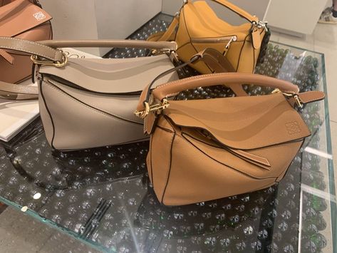 side by side comparison of taupe and tan loewe puzzle bag in blog post sharing review