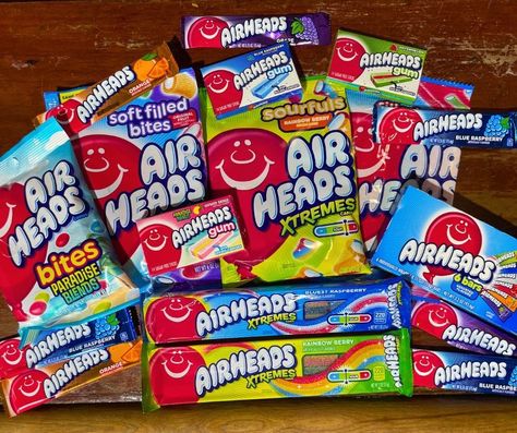 Ready to get XTREME with Airheads?! Check out our top Airheads candy picks and stay tuned for a special announcement in the coming weeks! Born in 1985, Airheads weren't always light and airy! This chewy taffy took flight thanks to Steve Bruner, who craved a catchy name and a "new high in fruity flavors". Guess "Airhead" and a red balloon did the trick! #AirheadsCandy #CandyHistory #80sTreats Airheads Aesthetic, Airheads Candy, Catchy Name, Catchy Names, Red Balloon, Blue Raspberry, Taffy, Sweet Memories, Vintage Tees