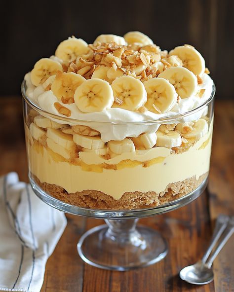 "This is my go-to recipe for Banana Pudding Trifle! It’s always a crowd-pleaser and brings back so many sweet memories.  Ingredients: - Ripe bananas - Vanilla pudding - Whipped cream - For additional ingredients, Link in first comment [👇] [👇]  This dessert is creamy, dreamy, and oh-so-delicious! Perfect for parties or just a sweet treat at home.   #BananaPudding #Trifle #DessertRecipe #Yummy #SweetTreat" Banana Pudding Serving Ideas, Banana Pudding Aesthetic, Pudding Aesthetic, Recipe For Banana Pudding, Peanut Butter Banana Recipes, Pudding Trifle, Banana Pudding Trifle, Dessert Banana, Banana Recipes Overripe