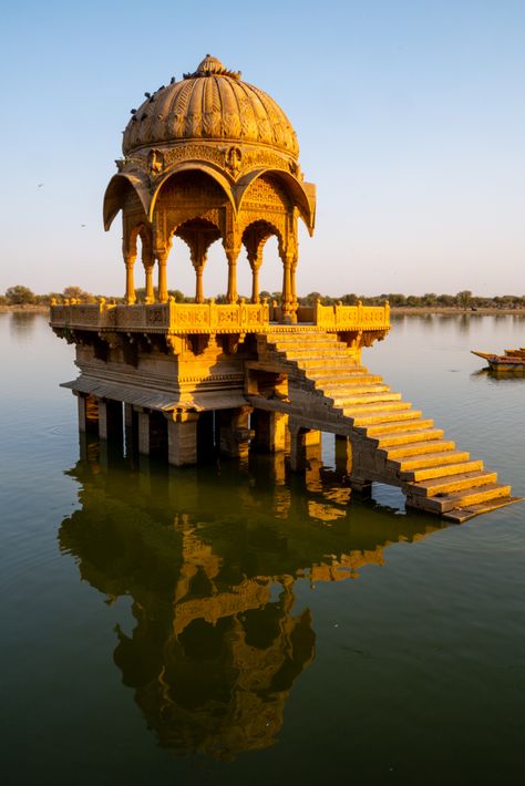 Beneath the shadow of Jaisalmer Fort, India’s Golden City shines in the desert sun. Bustling markets, intricately carved havelis, and golden chhatris above Gadisar Lake mark this ancient city on the edge of the Thar Desert. Tucked in the western corner of Rajasthan between India and Pakistan, the Thar Desert is the largest desert in India. As the sun casts a warm glow over Jaisalmer Fort, the desert beauty of Jaisalmer transcends the passage of time. Golden City Jaisalmer, Gadisar Lake, Jaisalmer Fort, Thar Desert, Desert Beauty, Applied Art, Golden City, Desert Sun, Jaisalmer