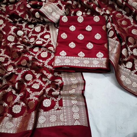 This Traditional Pure Handloom Banarasi silk suit made by Taj Silk Saree exudes elegance and sophistication. The suit is crafted using age-old weaving techniques, passed down from generation to generation, by skilled artisans in the holy city of Varanasi. The Banarasi silk fabric is known for its rich texture, intricate designs, and lustrous finish, making it a perfect choice for formal occasions and weddings. The suit is adorned with intricate zari work, using gold or silver threads, which add Banarasi Silk Suit, Silk Suit, Zari Work, Varanasi, Rich Textures, Weaving Techniques, Formal Occasion, Silk Fabric, Silk Saree