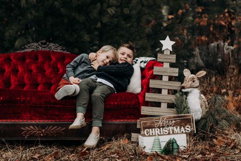 Red couch Christmas photo shoot Red Couch Christmas Photoshoot, Red Couch Photoshoot, Christmas Couch Photoshoot, Reem Photography, Winter Poses, Red Rocking Chair, Christmas Tree Farm Photo Shoot, Tree Farm Photo Shoot, Christmas Mini Shoot