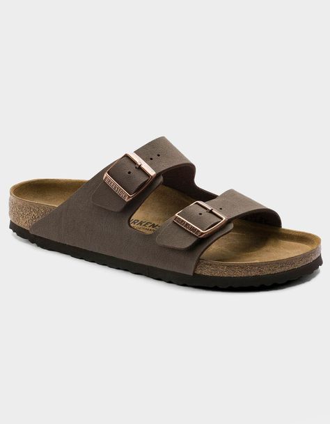 Birkenstock Arizona Sandals. The Often Imitated, Never Duplicated, Category-Defining, Two-Strap Wonder From Birkenstock. A Comfort Legend And A Fashion Staple. With Adjustable Straps And A Magical Cork Footbed That Conforms To The Shape Of Your Foot, A Truly Custom Fit Is As Effortless As The Classic Design. -narrow Width (fits Like A Us Medium Width) -birkibuc – A Durable, Synthetic Upper Material With A Nubuck Leather-Like Texture And A Soft Backing -contoured Cork Footbed Conforms To The Shape Of Your Foot And Features Pronounced Arch Support, A Deep Heel Cup, And Roomy Toe Box; Lined With Suede -lightweight Eva Sole For Cushioning And Shock Absorption -avoid Extreme Heat -imported | Birkenstock Arizona Mocha Sandals Birkenstock Arizona Mocha, Clear Backpacks, Unisex Sandals, Birkenstock Sandals Arizona, Complete Skateboards, Extreme Heat, Kids Sandals, Eva Sole, Birkenstock Arizona