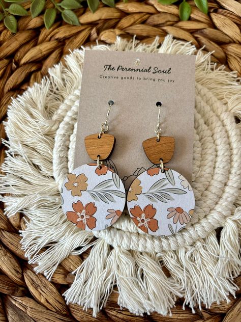 Cute printed wood round earrings with a lovely floral print. Colors included are rust, dark mustard yellow, mauve, sage green on a white background. This floral wood circle is paired with a cherry wooden piece to complete the look. These earrings have a nickel free sterling silver plated ear wire, perfect for sensitive ears. Drop down length is about 2.5 inches. A great neutral piece to go with many outfits. Lightweight and perfect for all day wear! These earrings also make a great gift! Wooden Flower Earrings, Wood Laser Engraving Machine, Laser Cut Wood Jewelry, Dark Mustard Yellow, Laser Crafts, Glowforge Projects, Laser Cut Wood Earrings, Wood Burning Crafts, Earrings Wood