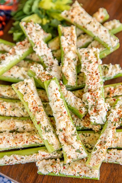 Italian Cream Cheese Stuffed Celery - outrageously good with only 5 ingredients! A party favorite! Can make in advance and refrigerate until ready to serve. Celery, cream cheese, Italian dressing mix, mayonnaise, and mozzarella cheese. This is always the first thing to go! Great for game day, parties, potlucks, and the holidays! #celery #appetizer #gameday #thanksgiving #christmas #stuffedcelery Cream Cheese Dressing For Salad, Vegetable Party Appetizers, Cold Vegetable Appetizers, Ballgame Food Ideas, No Meat Appetizers, Appetizers For Diabetics, Vegetable Appetizers Finger Foods, Celery Cream Cheese, Cream Cheese Stuffed Celery