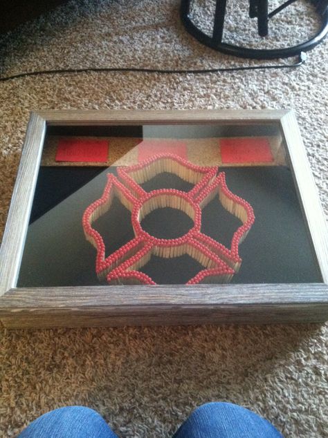 Matches Maltese cross in a shadow box. Firefighter. Floral foam, spray paint, matches, shadow box, cork board. Fire Dept Decor, Firefighter Cookie, Firefighter Room, Firefighter Crafts, Fire Crafts, Foam Spray, Firefighter Decor, Fire Life, Firefighter Gifts