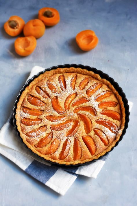 Made with seasonal stone fruits and a creamy almond custard, the Apricot Frangipane Tart is a French classic, all summer-round. In this home-made buttery crust, it’s pure delight!   In France,… Apricot Frangipane, Almond Custard, Galette Des Rois Recipe, Apricot Tart, Cherry Clafoutis, Apricot Recipes, Frangipane Tart, Bakewell Tart, Fruit Tarts