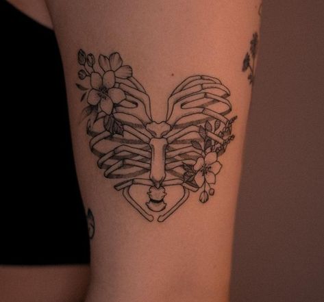 Skeleton With Heart Tattoo, Sleeve Tattoo Inspo For Women, Soft Feminine Tattoo, Heart Elbow Tattoo, Patchy Sleeve Tattoo, Inner Elbow Tattoos, Watercolor Tattoo Ideas, Skeleton Tattoos, Elbow Tattoos