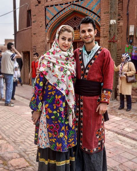 A Persian couple wearing traditional dress of Abyaneh village, in Isfahan. You can choose our village tour to touch the pure Iranian culture still alive in villages. https://www.irandestination.com/tour/iran-villages-tour/  #Iranvillage  #Irantravelagent #Irandestination #Irantravelagency #Irantourpackages #Persiantravelagency #Irantravel #traveltoIran   #coupletravel #halaltravel #Iran #traditionaldress #abyaneh #redvillage Iran Outfit, Iran Clothes, Iran Clothing, Iranian Clothes, Persian Dress, Persian Princess, Persian People, Persian Women, Iran Culture