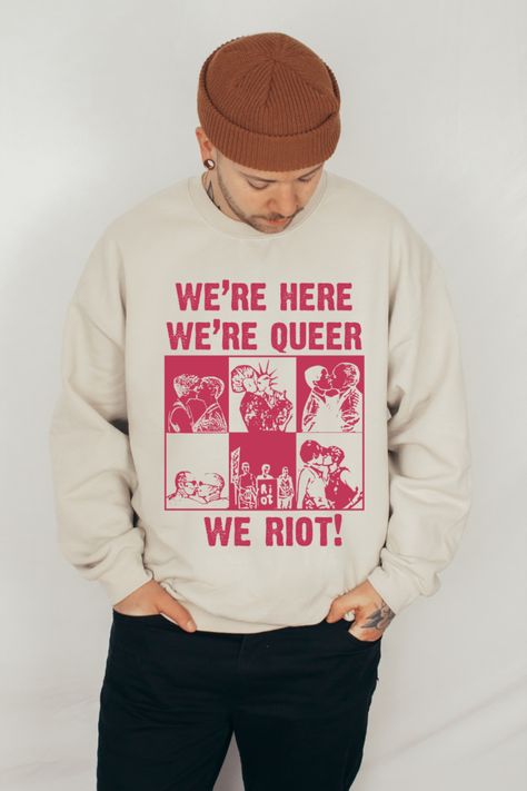 Be loud and unapolgetically queer in the We're Here We're Queer We Riot Shirt. Not just for pride month but all year around. Find this and other queer shirts at Kindfindapparel on Etsy. Queer clothing, gay rights, pride outfits, LGBTQ Sweatshirts, LGBTQ Shirts Queer Clothing, Lgbtq Shirts, Queer Clothes, Queer Femme, Clothing Prints, Queer Shirt, Masc Fashion, Masc Women, Gender Fluid Fashion