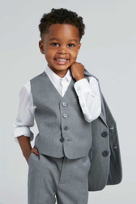 Fulfilled by our friends at SuitShopMade from the same breathable fabric as our textured grey adult suiting, this kids grey suit is ideal for your ring bearer or junior groomsmen in any climate or season. This four-piece kids grey suit set can be worn all together or styled as you wish! Select from the toddler and youth suit sizes 2T to 10.