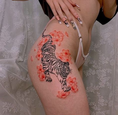 Tiger Neck Tattoo For Women, Tiger Tattoo Stomach Women, Tiger Tattoo With Cherry Blossoms, Hip Tiger Tattoos Women, Thigh Tiger Tattoo Women, Tiger Tattoo For Women Stomach, Hip Tiger Tattoo, Tiger In Flowers Tattoo, Hip Tattoo Tiger