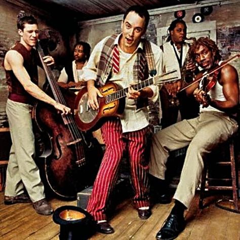 April 28, 1998: Before These Crowded Streets by the Dave Matthews Band debuts at Number 1 on the US albums chart. The Dave Matthews Band made their reputation through touring, spending endless nights on the road improvising. Often, their records hinted at the eclecticism and adventure inherent in those improvisation, but Before These Crowded Streets is the first album to fully capture that adventurous spirit. Music Rooms, Dave Matthews Band, I'm With The Band, Dave Matthews, Band Photos, New Rock, I Love Music, All Music, Music Love