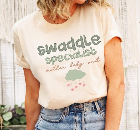 Swaddle Specialist, Mother Baby Nurse, Baby Nurse Shirt, Baby Nurse Sweatshirt,  Mom Baby Nurse Shirt, ob nurse tee, Postpartum nurse shirt. Mother Baby Nurse, Nursing Baby, New Nurse, School Tees, Nurse Sweatshirt, Mother And Baby, Nursing Shirts, Mom And Baby, Nurse Gifts