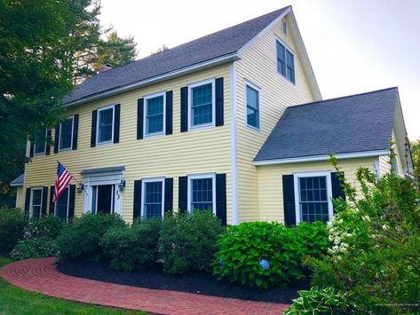 Yellow colonial house with black shutters and white trim Yellow House Black Shutters, Colonial Revival House Exterior, Colonial Home Exteriors, Side Hall Colonial, Colonial Shutters, Door Accents, Colonial Revival House, Yellow Exterior, Colonial House Exteriors