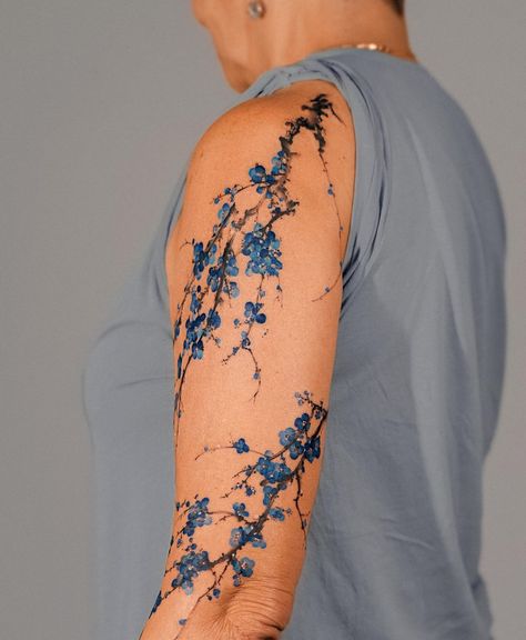 Black And Blue Ink Tattoo, Blue Tattoos On Brown Skin, Blue Cherry Blossom Tattoo, Troy Tattoo, Cherry Blossom Tattoo Men, Botany Tattoo, Flow Tattoo, Lightsaber Tattoo, Blue Ink Tattoos