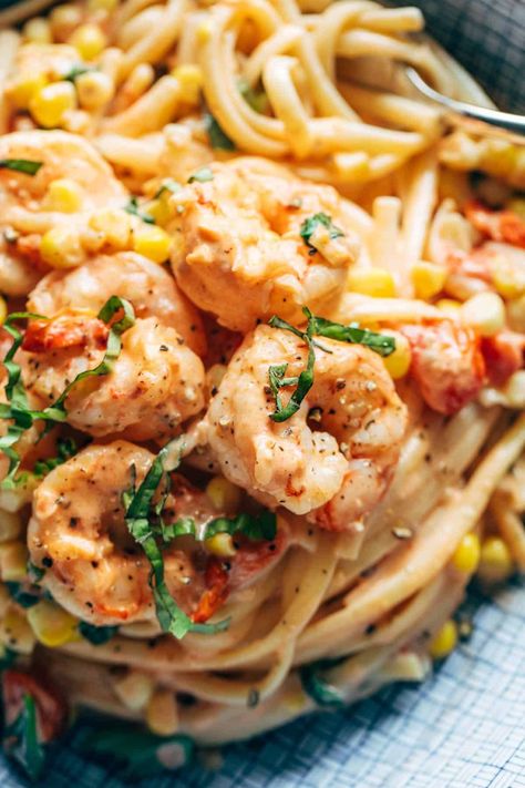 Creamy Shrimp Pasta with Corn and Tomatoes! A seriously delicious fresh summer pasta. Creamy, silky noodles, garlicky shrimp, and a punch of fresh corn, cherry tomatoes, and basil. #pasta #summer #corn Fresh Summer Pasta, Pasta With Corn, Pasta Summer, Garlicky Shrimp, Pasta Creamy, Creamy Shrimp Pasta, Corn Pasta, Pinch Of Yum, Creamy Shrimp